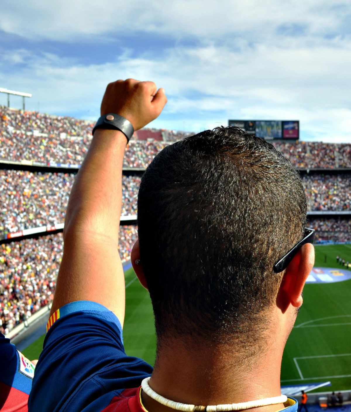 Soccer fan cheering on his team